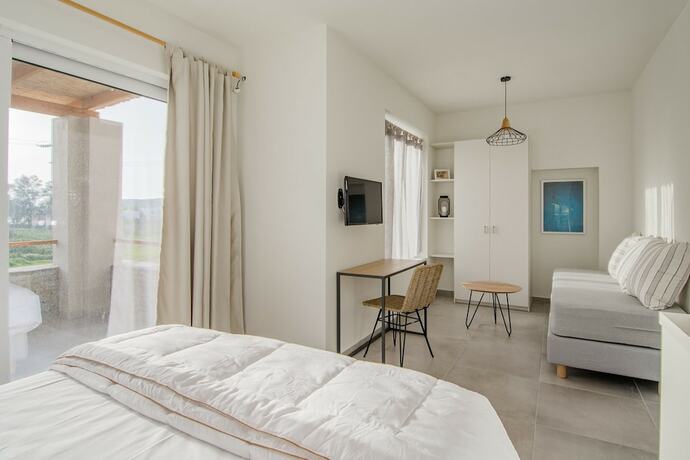 Imagen de la habitación del Hotel Vourkari Village. Foto 16