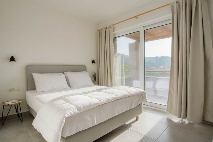 Imagen de la habitación del Hotel Vourkari Village. Foto 19