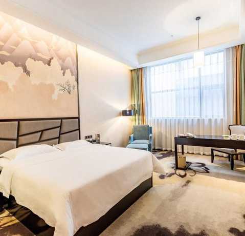 Imagen de la habitación del Hotel Vyluk J Hotel Wanda Plaza Xiajie Street. Foto 8