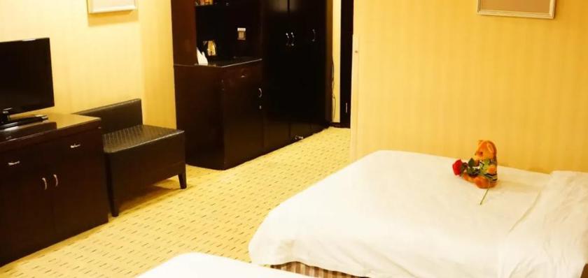 Imagen de la habitación del Hotel WANSHANG INTERNATIONAL HOTEL. Foto 8