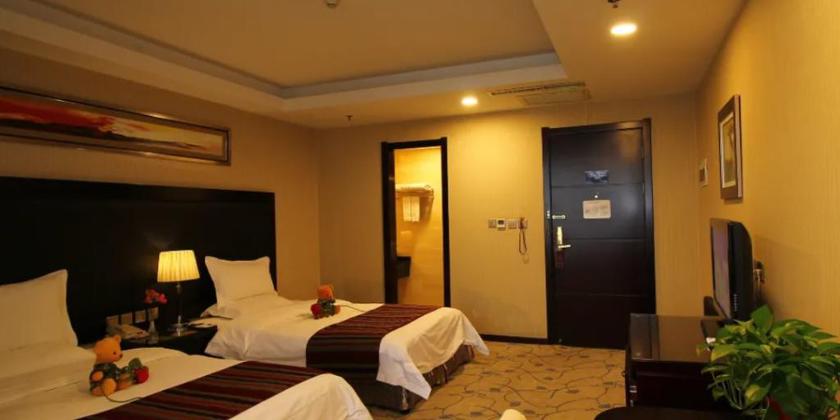 Imagen de la habitación del Hotel WANSHANG INTERNATIONAL HOTEL. Foto 9