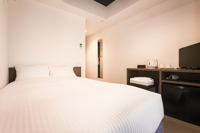 Imagen de la habitación del Hotel WAYFARER Shinsaibashi. Foto 13