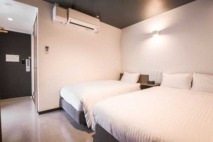 Imagen de la habitación del Hotel WAYFARER Shinsaibashi. Foto 15
