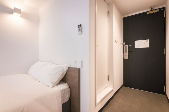 Imagen de la habitación del Hotel WAYFARER Shinsaibashi. Foto 16