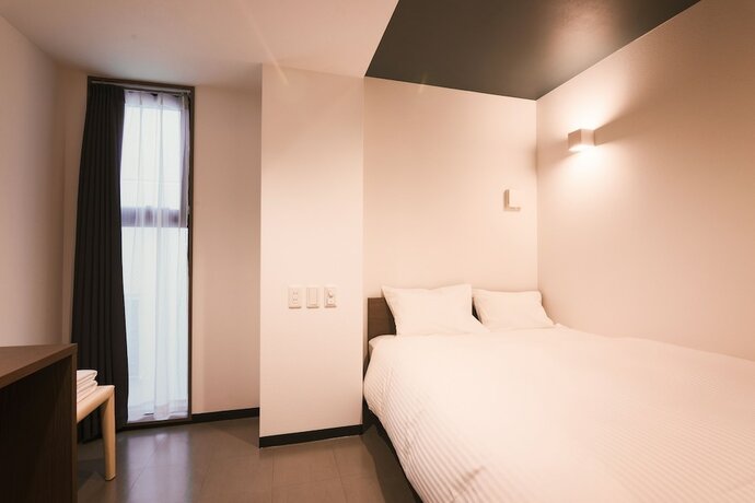 Imagen de la habitación del Hotel WAYFARER Shinsaibashi. Foto 17