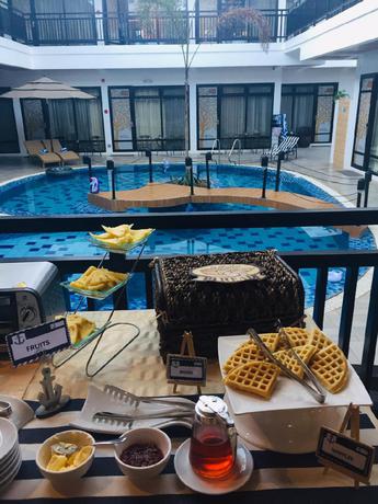 Imagen del bar/restaurante del Hotel WHITE BREEZE PALAWAN BOUTIQUE HOTEL. Foto 3