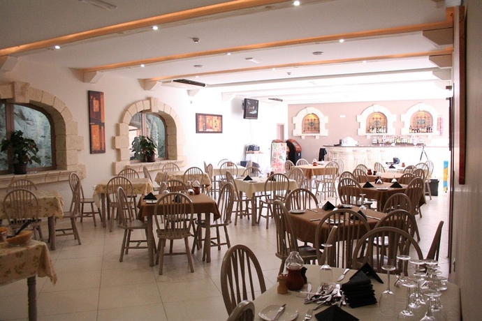 Imagen del bar/restaurante del Hotel WHITE DOLPHIN HOLIDAY COMPLEX. Foto 3