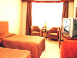 Imagen de la habitación del Hotel WUMAO. Foto 2