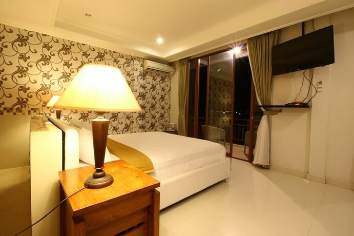 Imagen de la habitación del Hotel Wahyu Dana. Foto 31