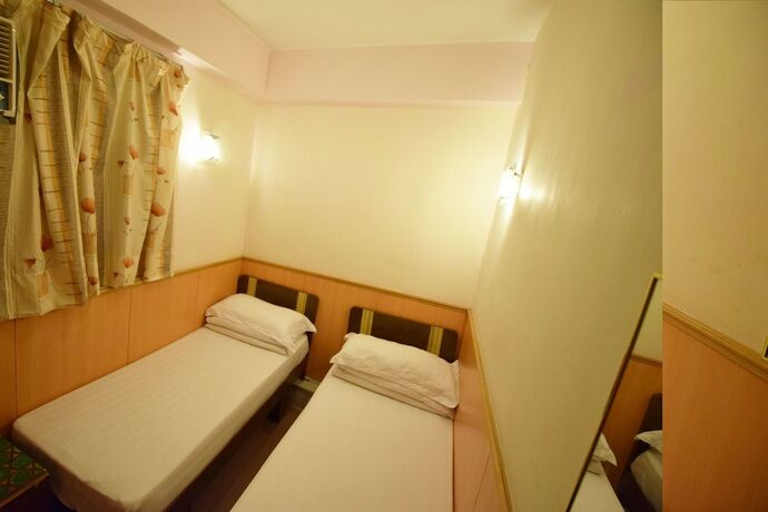 Imagen de la habitación del Hotel Wai Fan Guest House. Foto 9