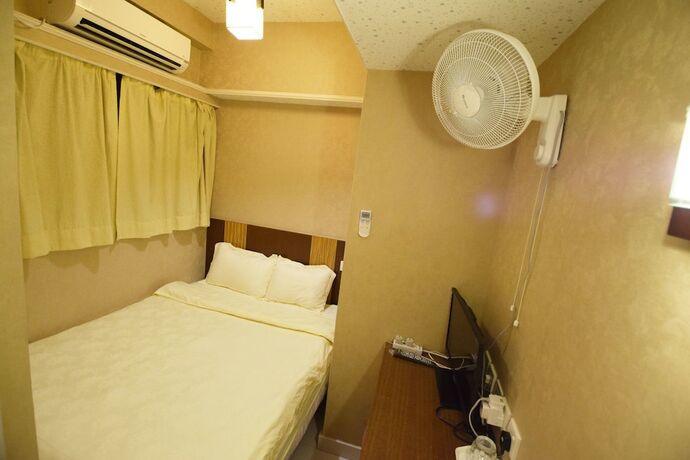 Imagen de la habitación del Hotel Wai Fan Guest House. Foto 11