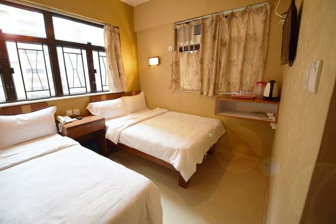 Imagen de la habitación del Hotel Wai Fan Guest House. Foto 13