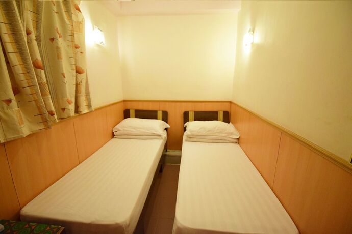 Imagen de la habitación del Hotel Wai Fan Guest House. Foto 14