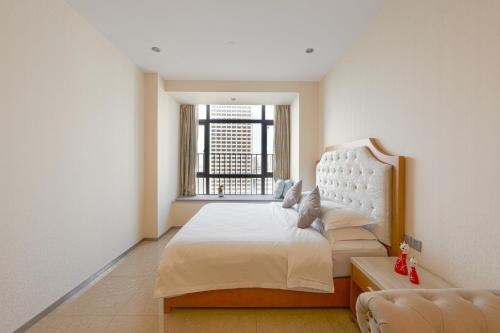 Imagen de la habitación del Hotel Waifiden Guangzhou Royal River Apartment(beijing R. Foto 7