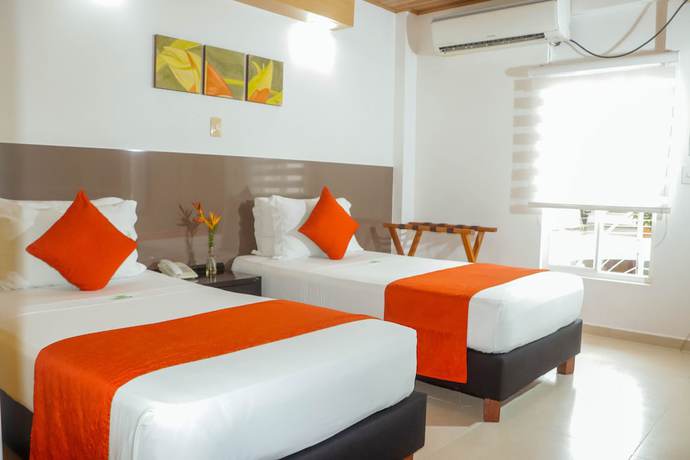 Imagen de la habitación del Hotel Waira Suites. Foto 16