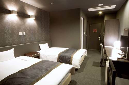 Imagen de la habitación del Hotel Wakayama Urban. Foto 2