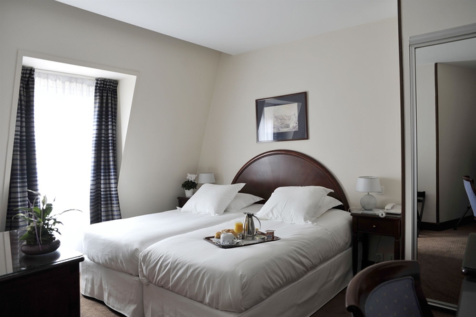 Imagen de la habitación del Hotel Waldorf Montparnasse. Foto 9