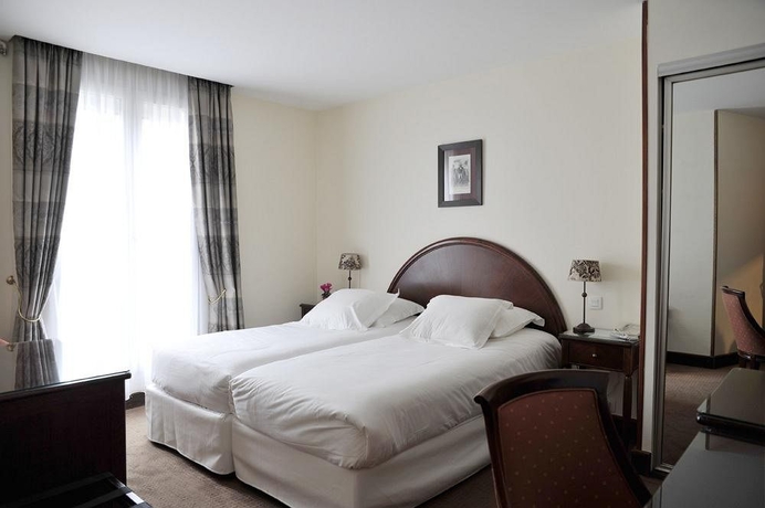 Imagen de la habitación del Hotel Waldorf Montparnasse. Foto 10