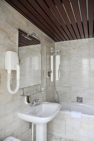 Imagen de la habitación del Hotel Waldorf Montparnasse. Foto 12