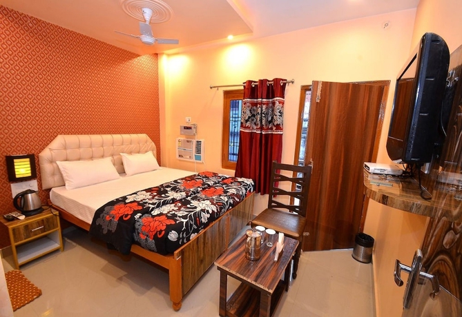 Imagen de la habitación del Hotel Walkin Shiva P Guest House. Foto 8
