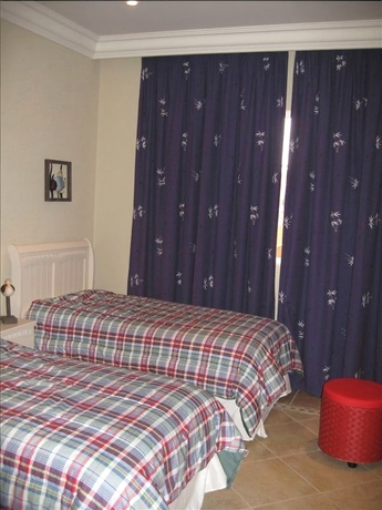 Imagen de la habitación del Hotel Walking To The Beach Villa. Foto 5