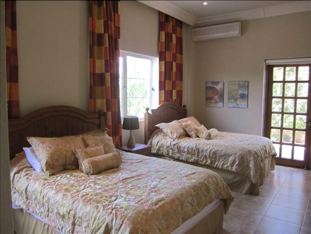 Imagen de la habitación del Hotel Walking To The Beach Villa. Foto 7