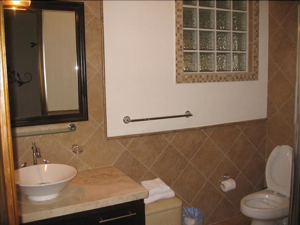 Imagen de la habitación del Hotel Walking To The Beach Villa. Foto 11