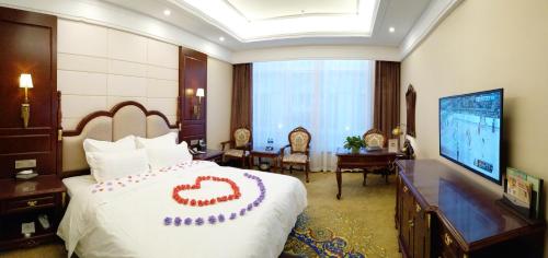 Imagen de la habitación del Hotel Wan Sheng International. Foto 7