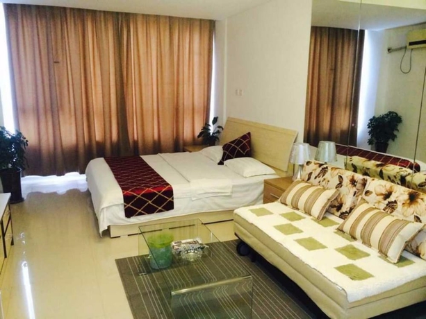 Imagen de la habitación del Hotel Wanda Gold Dragon Holiday Apartment. Foto 2