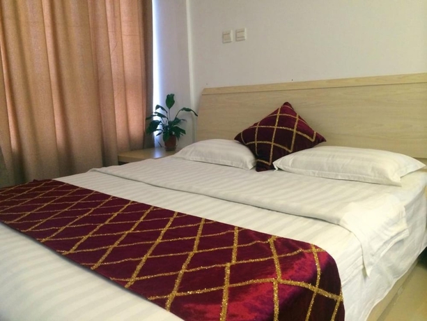 Imagen de la habitación del Hotel Wanda Gold Dragon Holiday Apartment. Foto 3