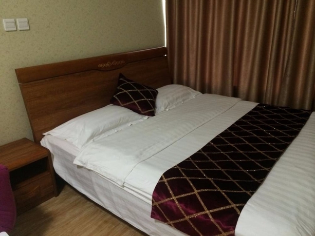 Imagen de la habitación del Hotel Wanda Gold Dragon Holiday Apartment. Foto 6