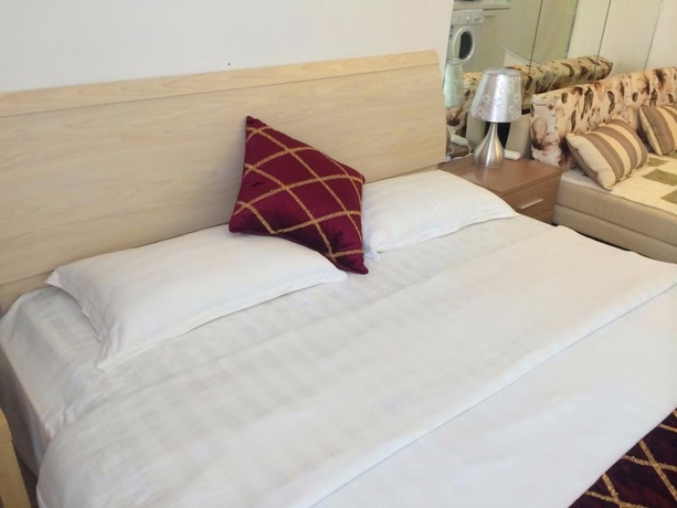Imagen de la habitación del Hotel Wanda Gold Dragon Holiday Apartment. Foto 7