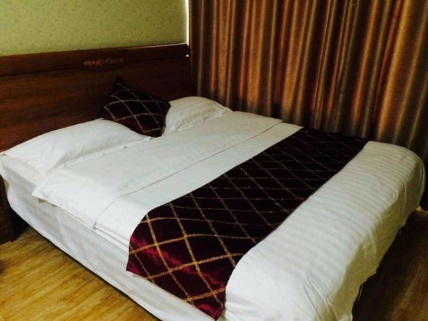 Imagen de la habitación del Hotel Wanda Gold Dragon Holiday Apartment. Foto 8