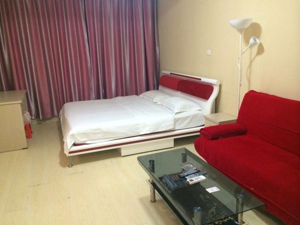 Imagen de la habitación del Hotel Wanda Gold Dragon Holiday Apartment. Foto 11