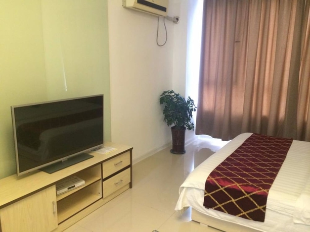 Imagen de la habitación del Hotel Wanda Gold Dragon Holiday Apartment. Foto 12