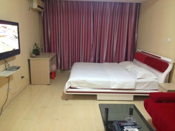 Imagen de la habitación del Hotel Wanda Gold Dragon Holiday Apartment. Foto 13