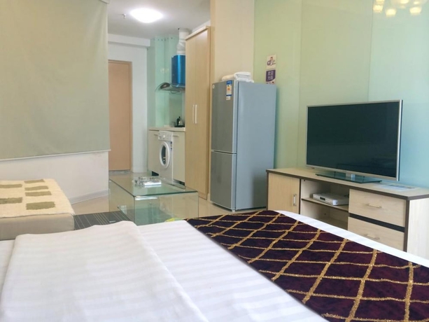 Imagen de la habitación del Hotel Wanda Gold Dragon Holiday Apartment. Foto 14