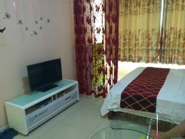 Imagen de la habitación del Hotel Wanda Gold Dragon Holiday Apartment. Foto 15