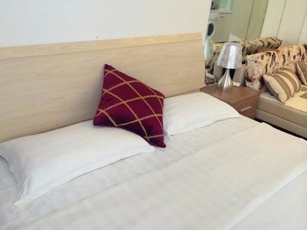 Imagen de la habitación del Hotel Wanda Gold Dragon Holiday Apartment. Foto 18