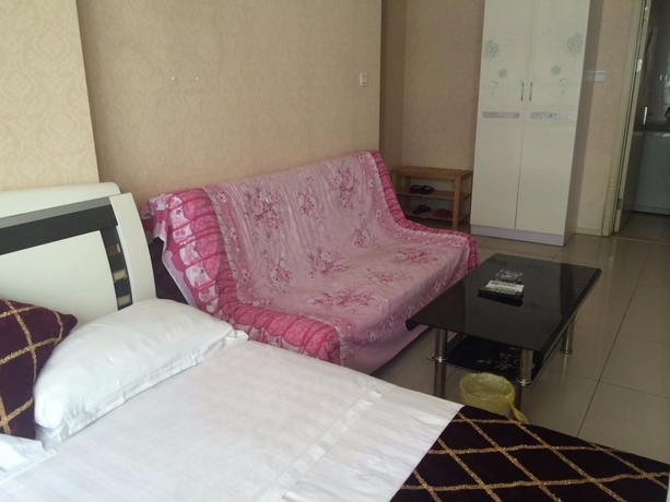 Imagen de la habitación del Hotel Wanda Gold Dragon Holiday Apartment. Foto 19
