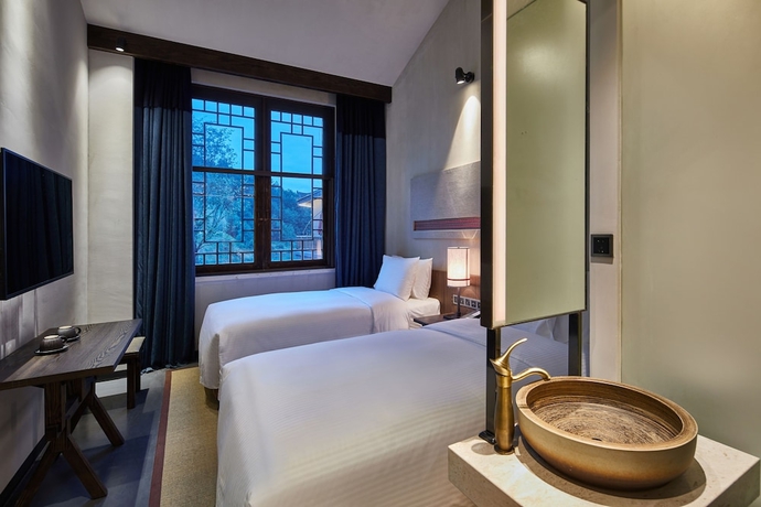 Imagen de la habitación del Hotel Wanda Jin Danzhai. Foto 7