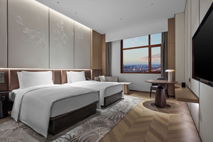 Imagen de la habitación del Hotel Wanda Jin Ordos. Foto 2