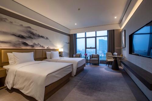 Imagen de la habitación del Hotel Wanda Jin Pingxiang, Luxi. Foto 9