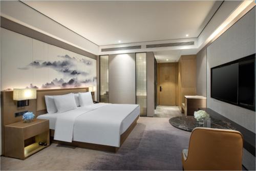Imagen de la habitación del Hotel Wanda Jin Pingxiang, Luxi. Foto 10