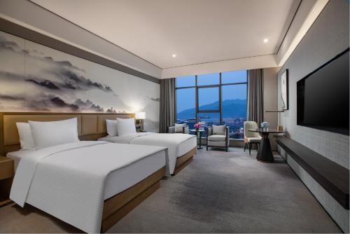 Imagen de la habitación del Hotel Wanda Jin Pingxiang, Luxi. Foto 13