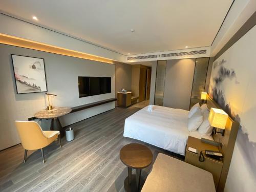 Imagen de la habitación del Hotel Wanda Jin Pingxiang, Luxi. Foto 14