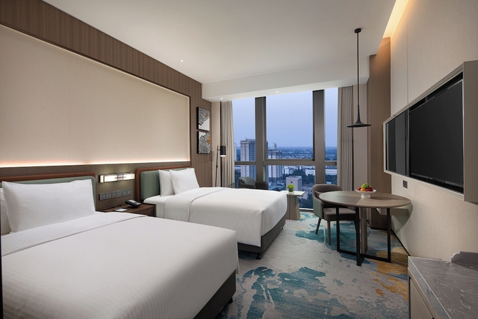 Imagen de la habitación del Hotel Wanda Jin Xiangjiang Dingzhou. Foto 2