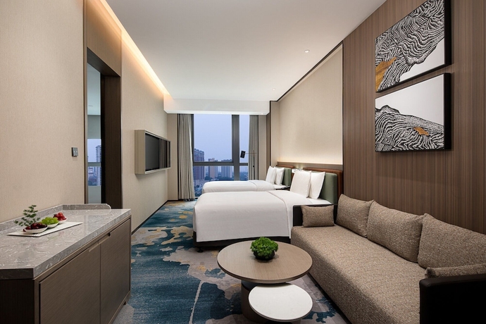 Imagen de la habitación del Hotel Wanda Jin Xiangjiang Dingzhou. Foto 4