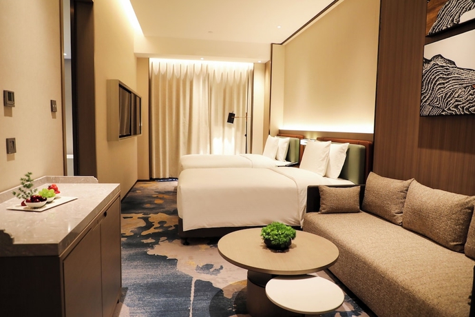 Imagen de la habitación del Hotel Wanda Jin Xiangjiang Dingzhou. Foto 6
