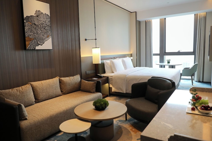 Imagen de la habitación del Hotel Wanda Jin Xiangjiang Dingzhou. Foto 12